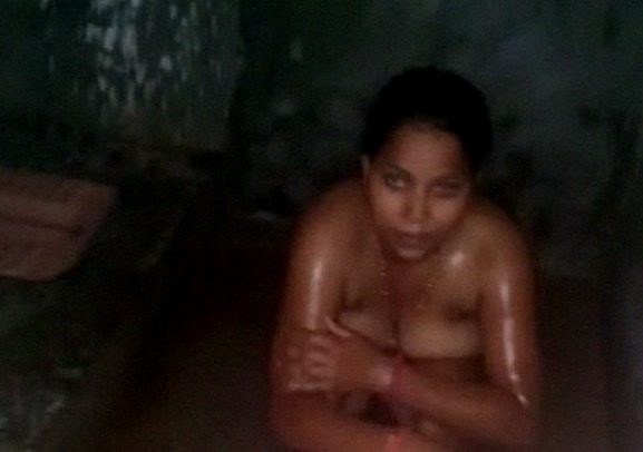 Beautiful village girl caught nude while having a bath