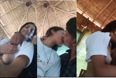 A guy presses a girl's boobs outdoors in the local sex video