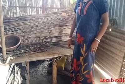 Bihari babu pounds his malkin outdoors in a hut